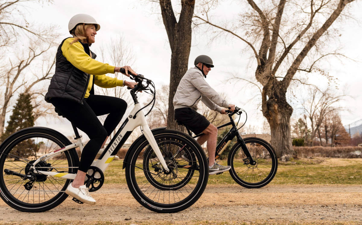 Senior Couple Riding E-Bikes in an Upright Riding Position