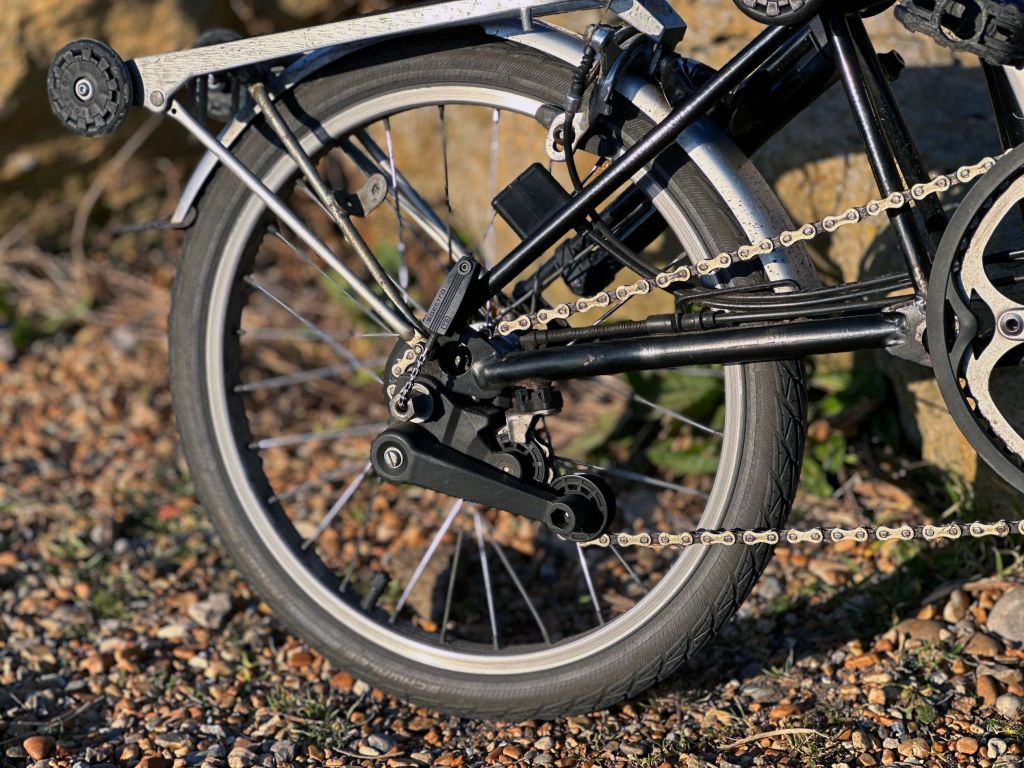 folding bike rear wheel and derailleur pictured close up