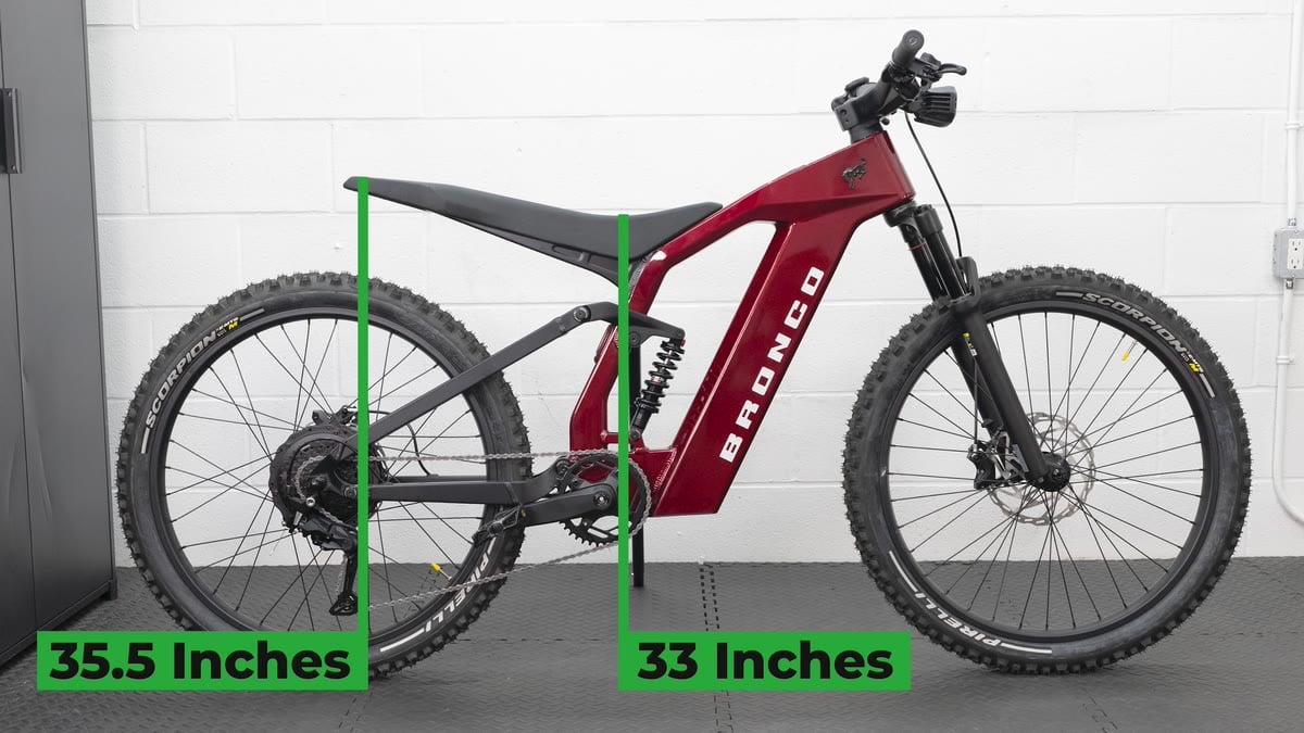 A test bike in the studio with its minimum and maximum saddle heights marked