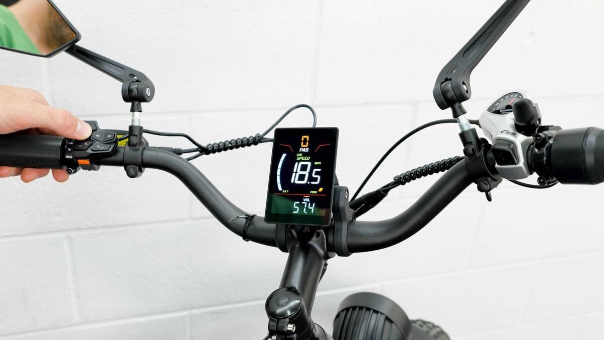 A bike cockpit with display, keypad and controls