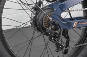 The 14–28t freewheel and Shimano Tourney derailleur behind the rear hub motor
