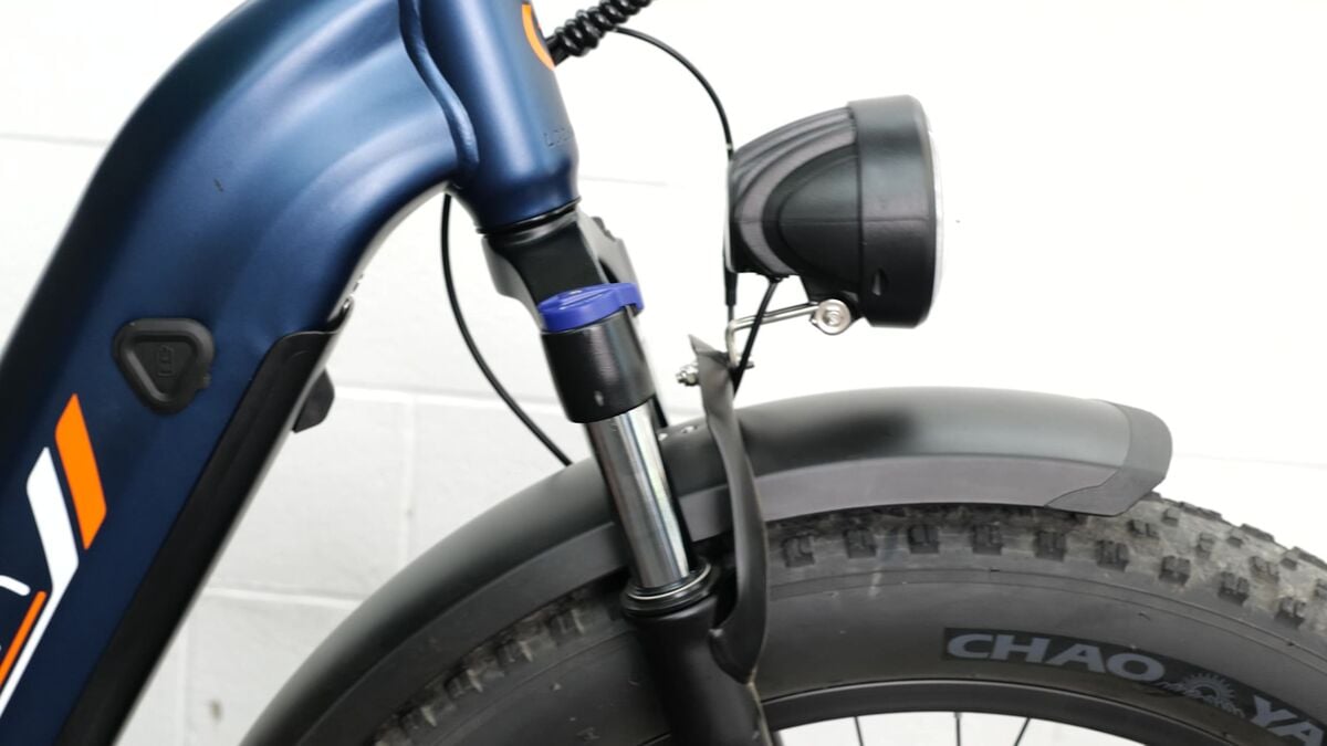 A close-up of an integrated headlight above the front fender
